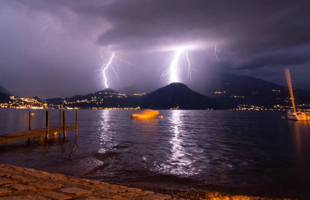 Lightning strikes at night in Lake Como, as seen from Varenna